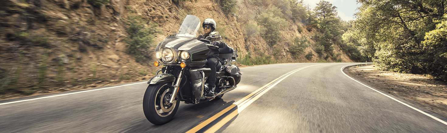 A man riding a 2020 Suzuki Venture motorcycle.